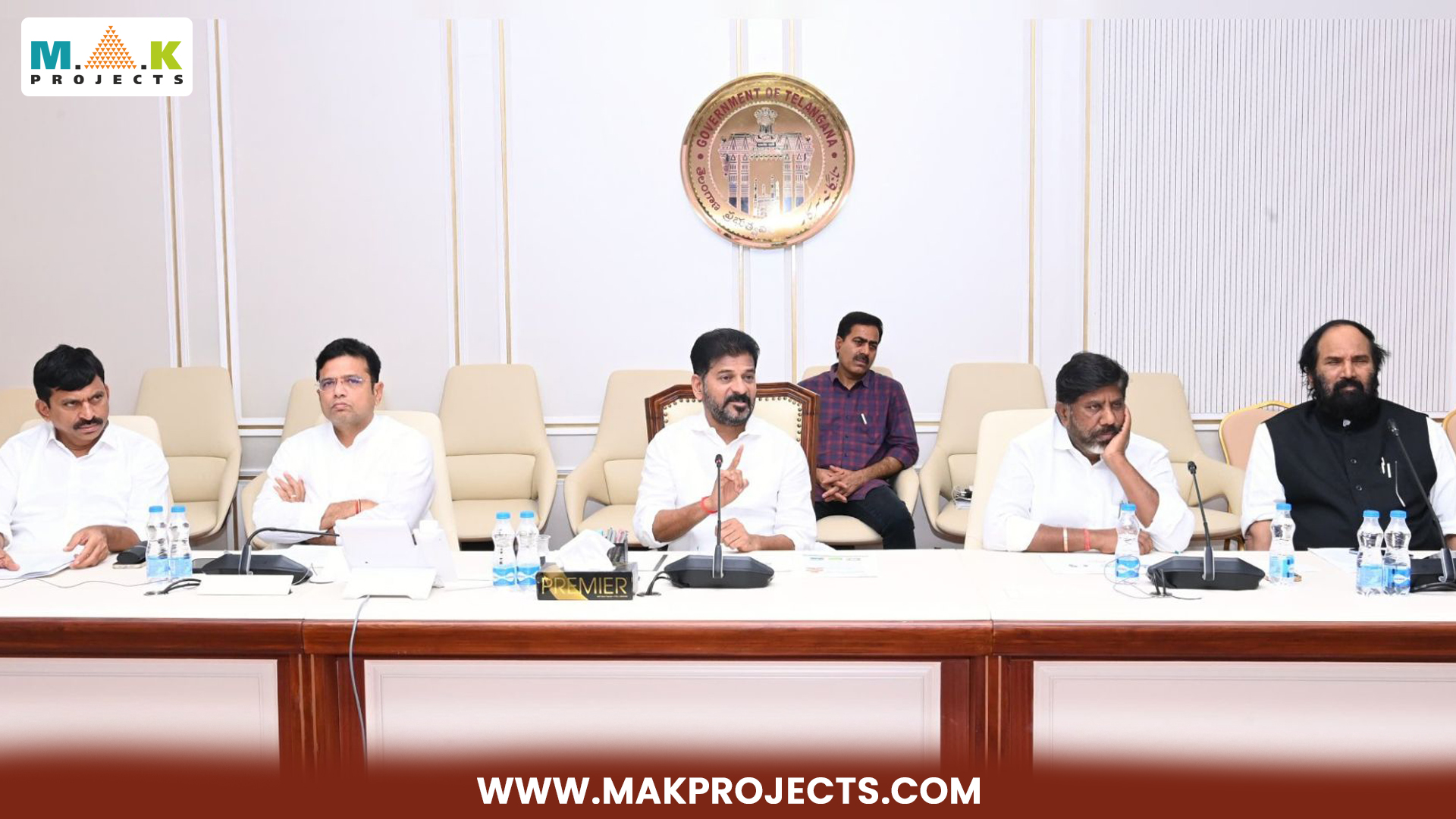 Chief Minister A. Revanth Reddy Addressing A Cabinet Meeting With Senior Officials, Discussing The Fourth City Project In Hyderabad. The Meeting Focuses On The Appointment Of A Senior Ias Officer To Oversee The Project And Related Developments. The Official Emblem Of The Government Of Telangana Is Visible In The Background, And The Participants Are Seated At A Conference Table In A Well-Furnished Room